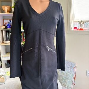 Understated sexy dress with zippered pockets!